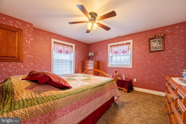 bedroom featuring light carpet and ceiling fan