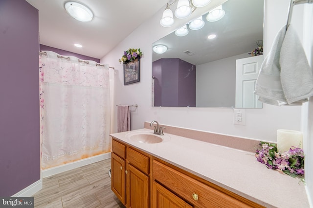 bathroom with vanity and curtained shower