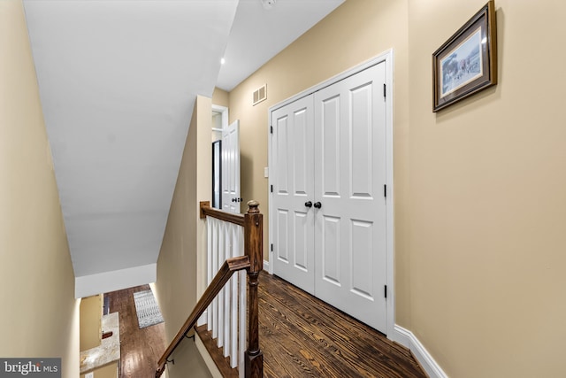 hallway with dark wood-type flooring