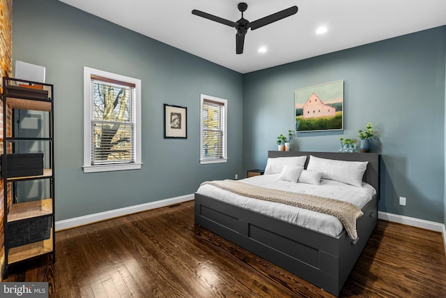 bedroom with dark wood-type flooring and ceiling fan