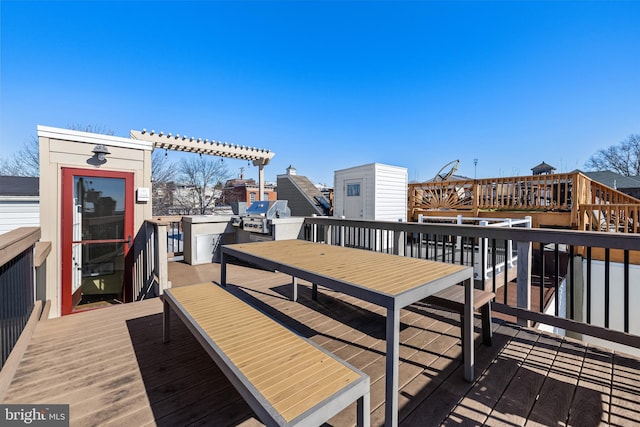 wooden terrace featuring a grill