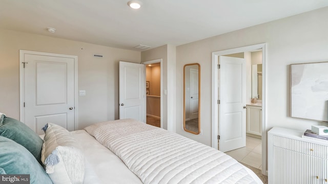 tiled bedroom with ensuite bathroom