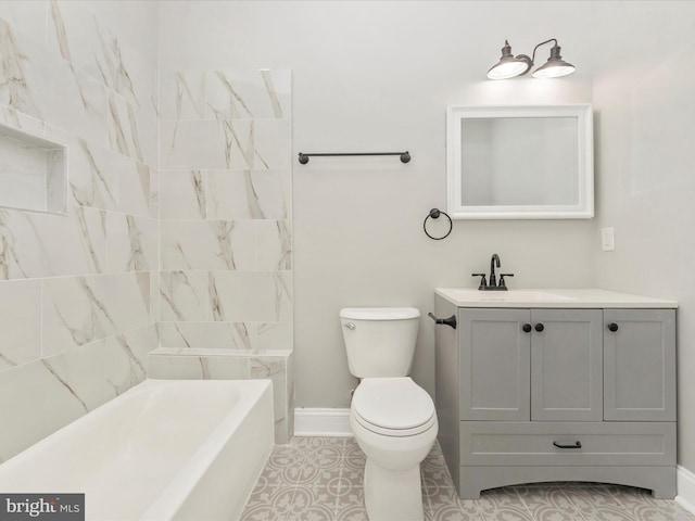 full bathroom with tile patterned floors, vanity, toilet, and tiled shower / bath combo