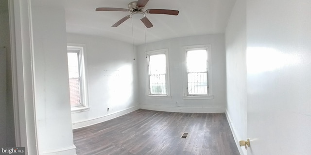 unfurnished room featuring ceiling fan and dark hardwood / wood-style floors