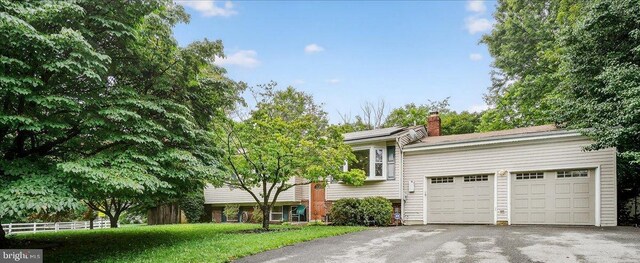 24200 Log House Rd, Gaithersburg, MD 20882 - view of front of property with asphalt driveway, a chimney, and an attached garage