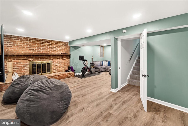24200 Log House Rd, Gaithersburg, MD 20882 - living area featuring wood finished floors, stairs, and a brick fireplace