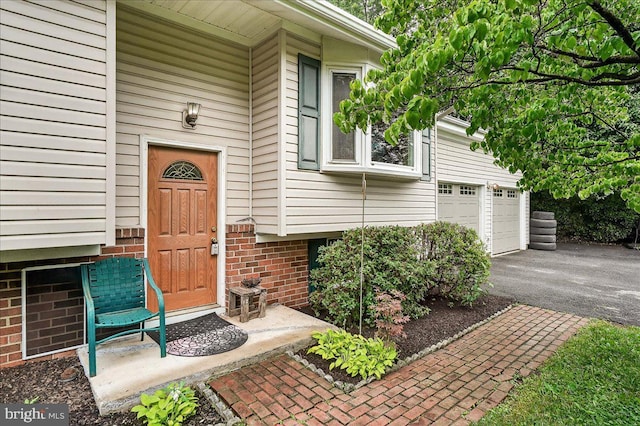 24200 Log House Rd, Gaithersburg, MD 20882 - doorway to property featuring a garage and driveway