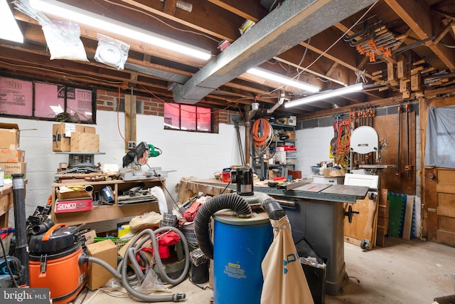 unfinished basement featuring a workshop area