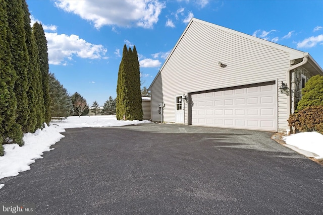 view of property exterior featuring a garage