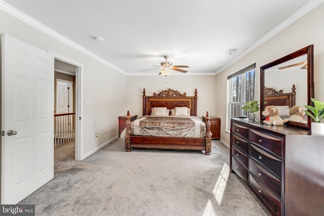 bedroom featuring crown molding, ceiling fan, and light carpet