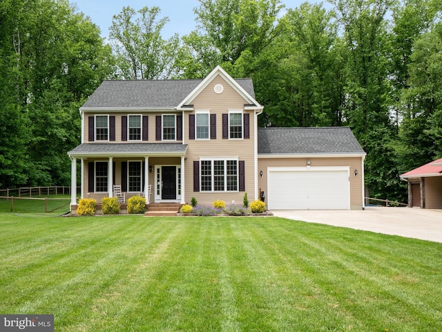 colonial inspired home with a garage, a front lawn, and a porch