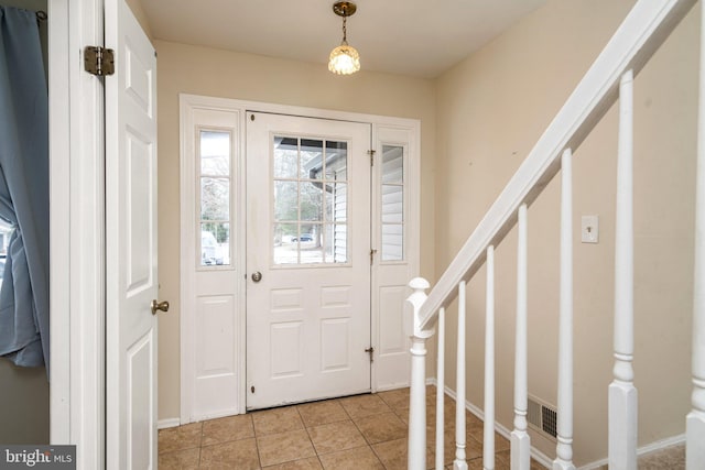 view of tiled foyer entrance