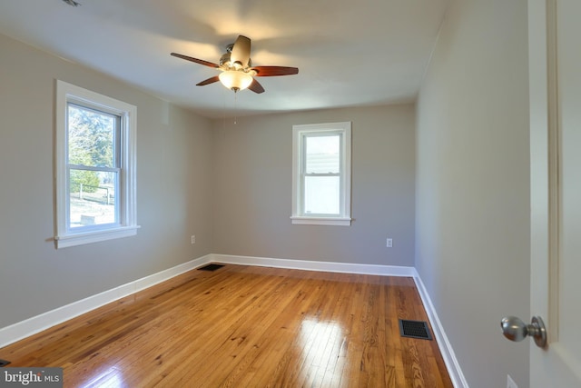 spare room featuring light hardwood / wood-style flooring and ceiling fan