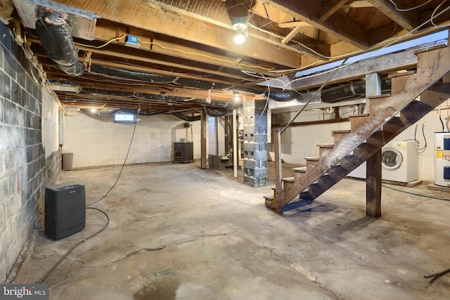 basement with washer / clothes dryer and water heater