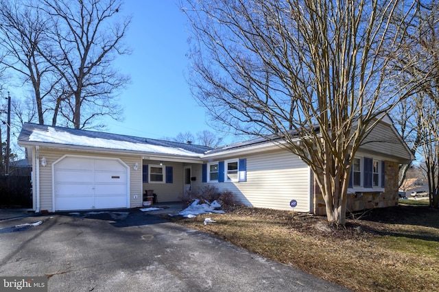 single story home with a garage