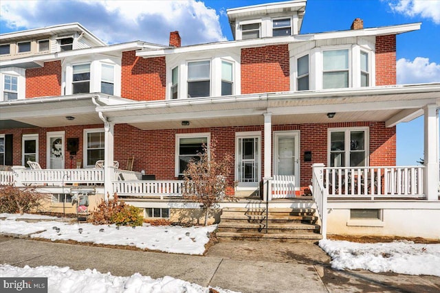 view of property featuring covered porch