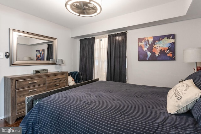 bedroom featuring dark hardwood / wood-style flooring