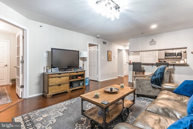 living room with dark hardwood / wood-style floors