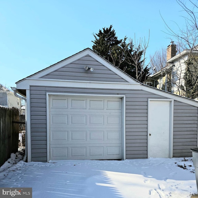 view of snow covered garage