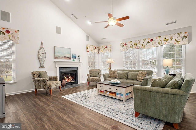 living room featuring ceiling fan, high vaulted ceiling, and dark hardwood / wood-style flooring