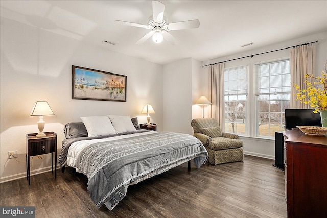 bedroom featuring ceiling fan and dark hardwood / wood-style flooring