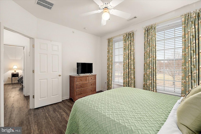 bedroom featuring dark hardwood / wood-style flooring and ceiling fan