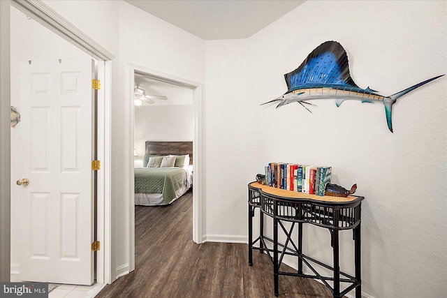 hallway with dark hardwood / wood-style floors