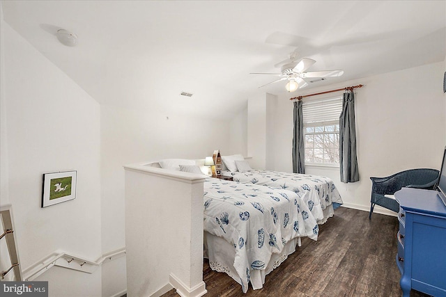 bedroom featuring ceiling fan and dark hardwood / wood-style floors