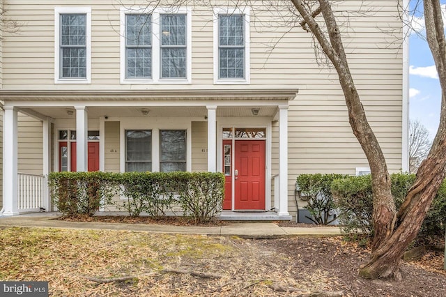 doorway to property with a porch