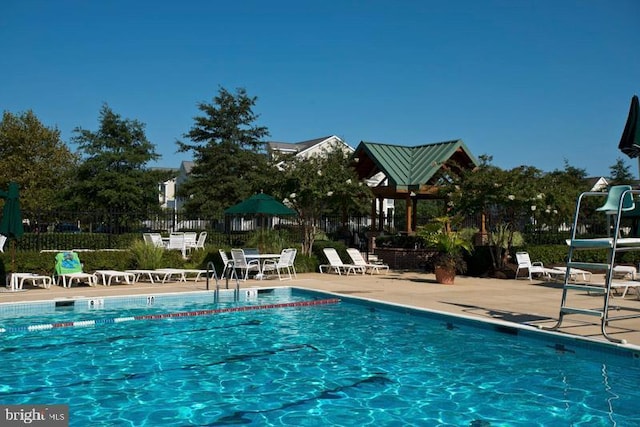 view of swimming pool with a patio