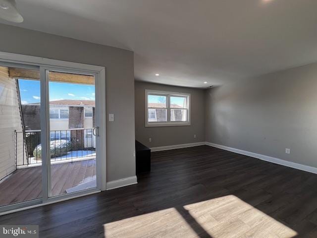 empty room featuring dark hardwood / wood-style flooring