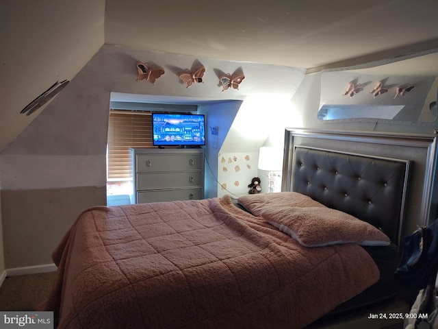 bedroom featuring vaulted ceiling