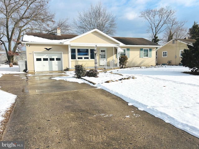 view of front of property with a garage and a porch