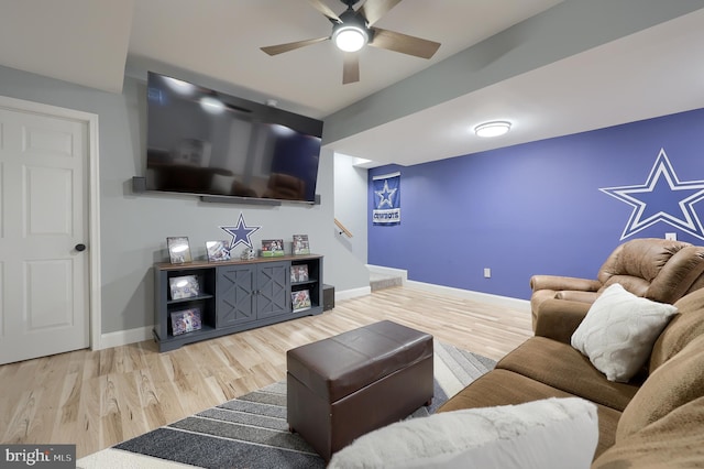 living room featuring hardwood / wood-style flooring and ceiling fan