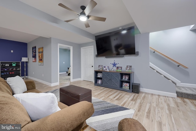 living room with ceiling fan and light wood-type flooring