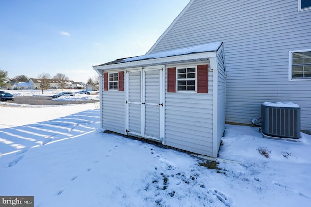 snow covered structure with central AC