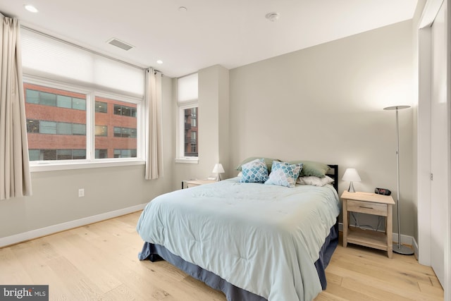 bedroom with light hardwood / wood-style flooring