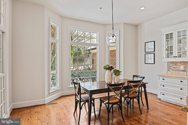 dining area with light wood-type flooring