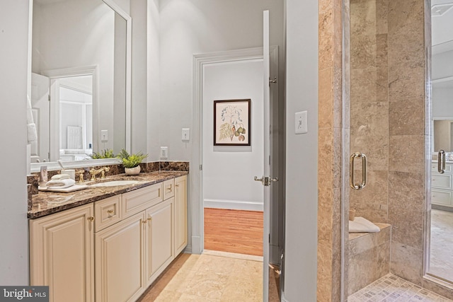 bathroom with vanity and walk in shower