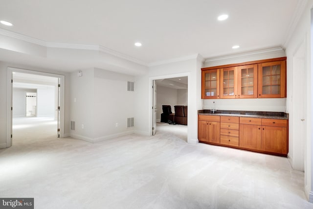 bar with ornamental molding and light colored carpet