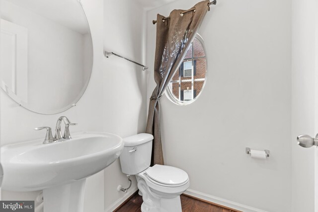 1324 Ray Ln, Glen Burnie, MD 21061 - bathroom with a sink, baseboards, toilet, and wood finished floors