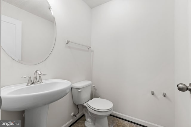 1324 Ray Ln, Glen Burnie, MD 21061 - half bathroom featuring baseboards, a sink, tile patterned flooring, and toilet