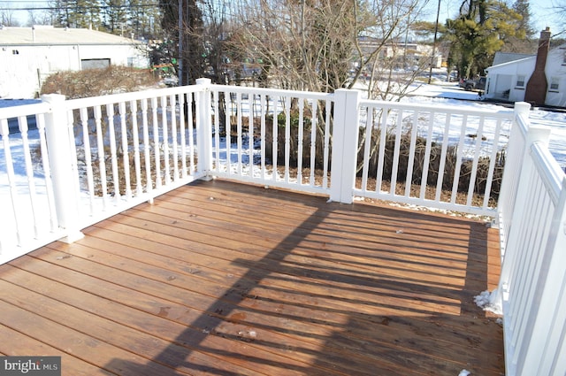 view of snow covered deck