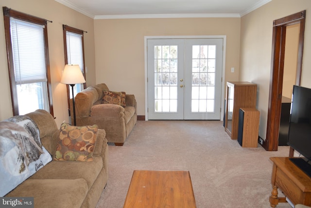 carpeted living room featuring a wealth of natural light, ornamental molding, and french doors