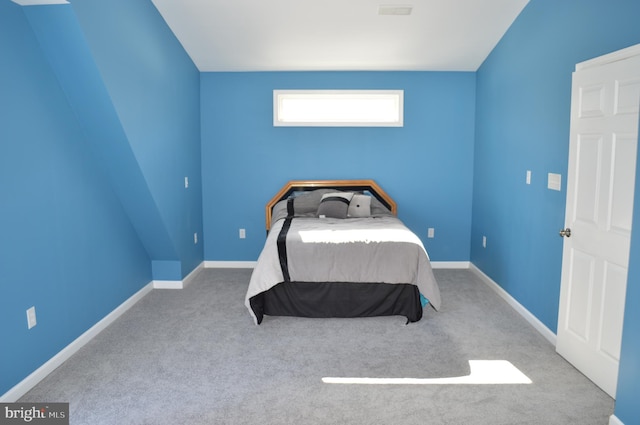 bedroom featuring light colored carpet