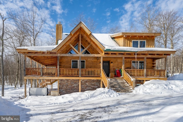 log home with covered porch