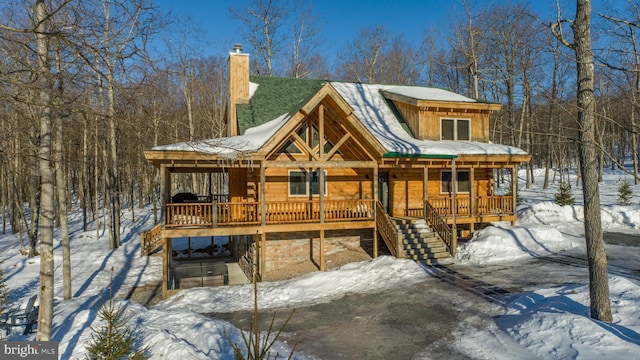 35 Blue Mountain Vw, Mc Henry, MD 21541 - view of front of house featuring stairs, board and batten siding, a chimney, and covered porch