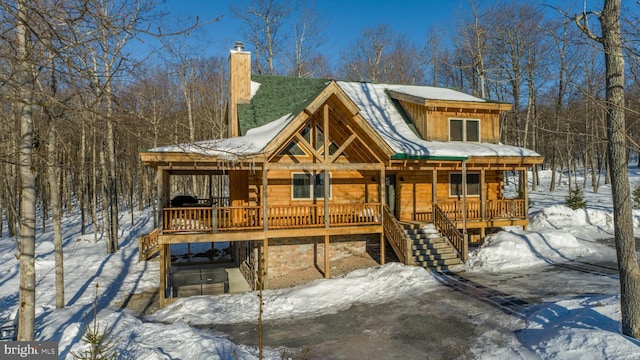 35 Blue Mountain Vw, Mc Henry, MD 21541 - view of front of property with board and batten siding, a porch, a chimney, and stairway