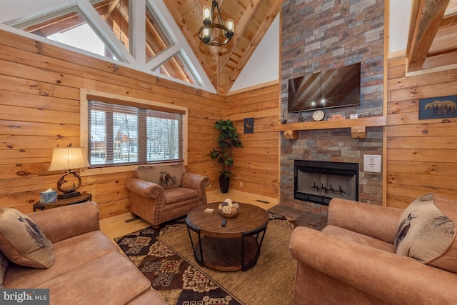35 Blue Mountain Vw, Mc Henry, MD 21541 - living room with wood walls, an inviting chandelier, vaulted ceiling with beams, and a tiled fireplace