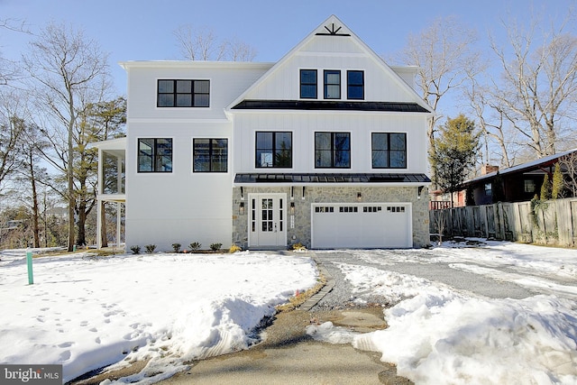 modern farmhouse style home with a garage